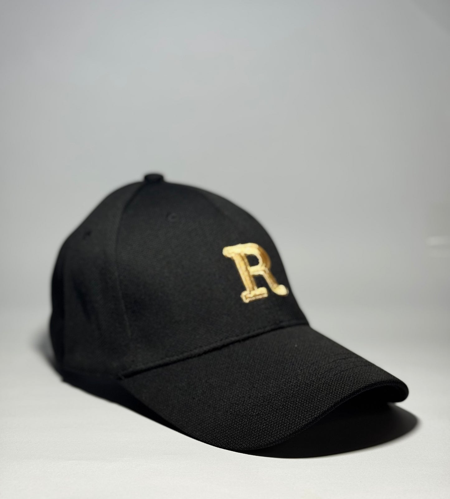 Black Baseball Cap with Gold Embroidered 'R'